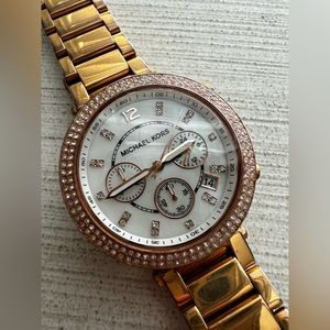 Michael Kors rose gold watch.